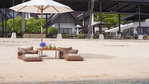 On the beach, sun-loungers, beach umbrellas, beach towels