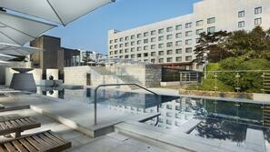 Seasonal outdoor pool, open 10 AM to 6:00 PM, pool umbrellas