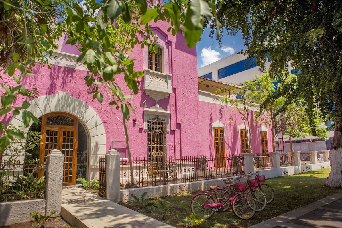 best hotels in merida mexico | rosas y xocolate exterior pink walls