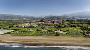 On the beach, sun-loungers, beach umbrellas, beach massages