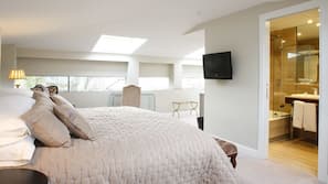 Ropa de cama de alta calidad, minibar, caja fuerte y escritorio