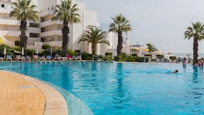 Indoor pool, outdoor pool, pool umbrellas, pool loungers
