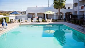 Outdoor pool, pool umbrellas, sun loungers