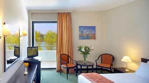Hypo-allergenic bedding, down comforters, minibar, in-room safe