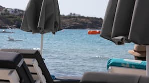 On the beach, sun loungers, beach umbrellas, beach towels