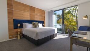 Premium bedding, desk, laptop workspace, blackout curtains