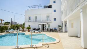 Seasonal outdoor pool, open 8:30 AM to 8 PM, pool umbrellas