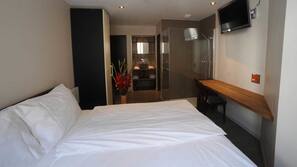 Desk, blackout drapes, soundproofing, iron/ironing board