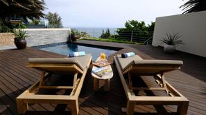 Seasonal outdoor pool, pool umbrellas, pool loungers