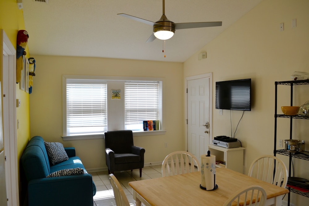 Living room, BEACH BUM COTTAGES - STEPS FROM BEACH, INGROUND POOL, PERFECT LOCATION