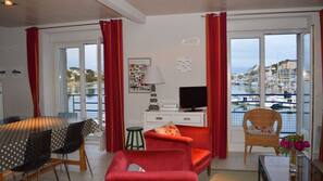 Flat-screen TV, DVD player, books