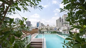 Outdoor pool, open 7:00 AM to 9:00 PM, pool umbrellas, pool loungers