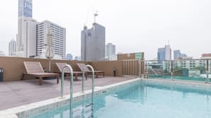 Outdoor pool, open 7:00 AM to 9:00 PM, pool umbrellas, pool loungers