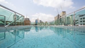 Outdoor pool, open 7:00 AM to 9:00 PM, pool umbrellas, pool loungers