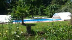 Seasonal outdoor pool, open 9:30 AM to 9 PM, pool loungers