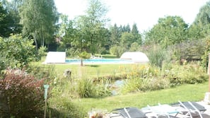 Seasonal outdoor pool, open 9:30 AM to 9 PM, pool loungers