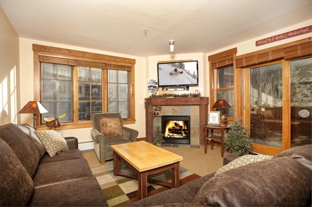 Rustic Alpine 4 Bedroom Condo With Plush Sofas And Private Balcony Featured Image