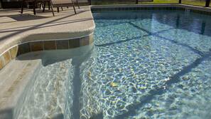 Seasonal outdoor pool, pool umbrellas, pool loungers