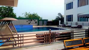 Outdoor pool, open 8 AM to 9 PM, pool umbrellas, sun loungers