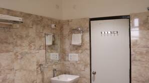 Shower, free toiletries, slippers, towels