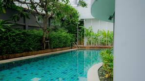 Outdoor pool, open 7:00 AM to 10:00 PM, pool umbrellas, pool loungers