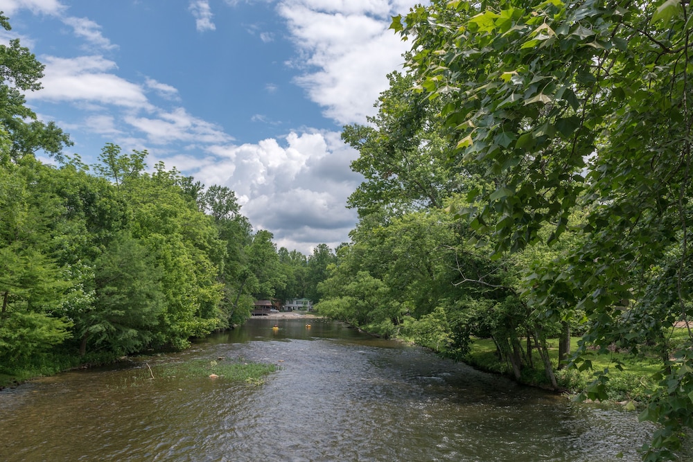 Riverfront condo with shared pool, firepit & decks walk to trails in