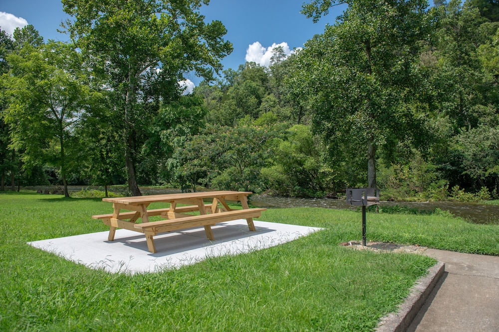 Riverfront condo with shared pool, firepit & decks walk to trails in