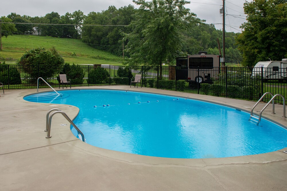 Riverfront condo with shared pool, firepit & decks walk to trails in