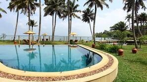 Outdoor pool, free pool cabanas, pool umbrellas
