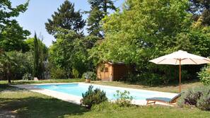Seasonal outdoor pool, open 9:00 AM to 8:00 PM, pool umbrellas