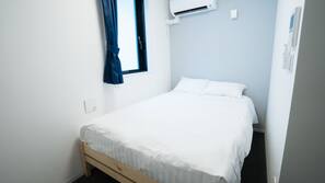 Blackout curtains, iron/ironing board, free WiFi, linens