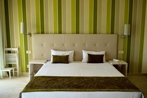 Minibar, desk, blackout drapes, bed sheets