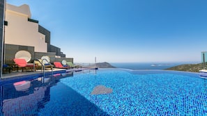 2 outdoor pools, pool umbrellas, pool loungers
