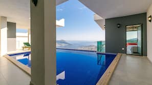 2 outdoor pools, pool umbrellas, pool loungers
