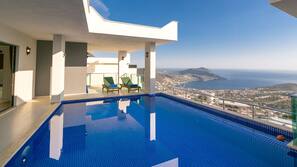 2 outdoor pools, pool umbrellas, pool loungers