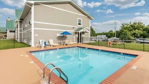 Seasonal outdoor pool, open 10:00 AM to 10:00 PM, pool umbrellas