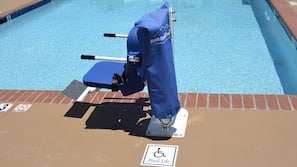 Seasonal outdoor pool, open 10:00 AM to 10:00 PM, pool umbrellas