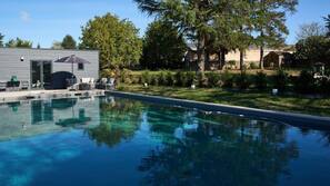 Outdoor pool, pool umbrellas, sun loungers