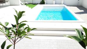2 outdoor pools, pool umbrellas, pool loungers