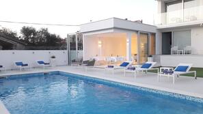 2 outdoor pools, pool umbrellas, pool loungers
