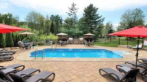 Seasonal outdoor pool, open 9:00 AM to 10:00 PM, pool umbrellas