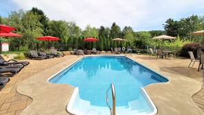 Seasonal outdoor pool, open 9:00 AM to 10:00 PM, pool umbrellas
