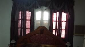Desk, blackout curtains, iron/ironing board, linens