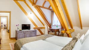 Premium bedding, down comforters, minibar, in-room safe