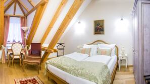 Premium bedding, down comforters, minibar, in-room safe