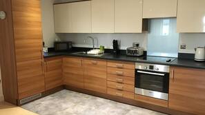 Fridge, hob, electric kettle, cookware/dishes/utensils