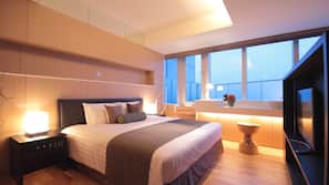 Premium bedding, down comforters, pillowtop beds, minibar