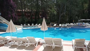 Seasonal outdoor pool, open 7:30 AM to 7:00 PM, pool umbrellas