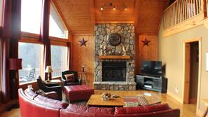 LCD TV, fireplace, DVD player, foosball