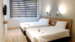 Desk, blackout curtains, free WiFi, linens